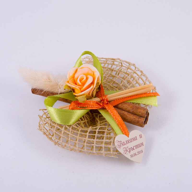 Cinnamon gift with ribbon and rose