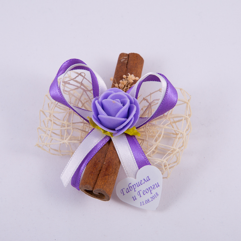 Cinnamon gift with ribbons and rose