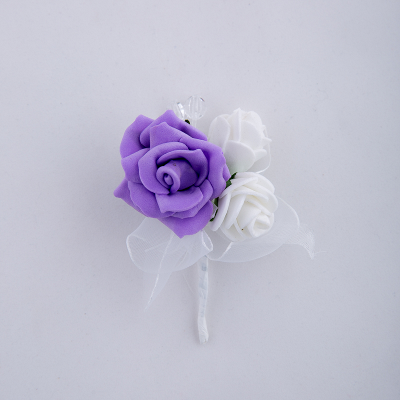 Boutonniere with white and purple roses