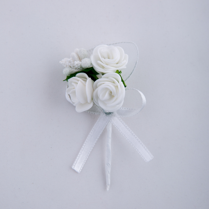 Boutonniere with roses and ribbon