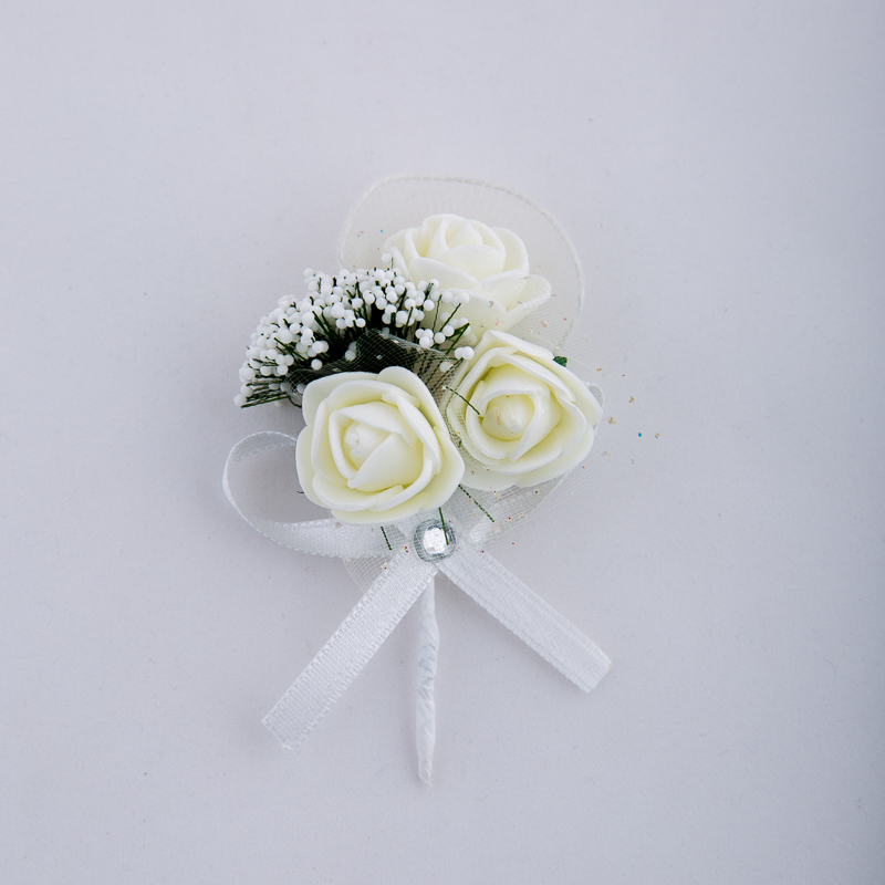 Boutonniere with roses and ribbon