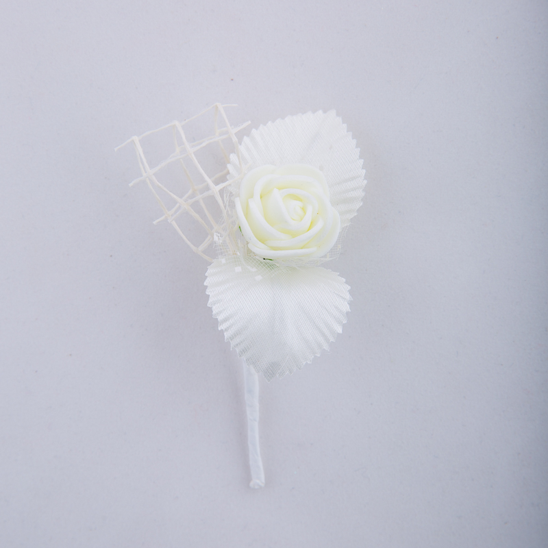 Boutonniere with a rose and net